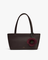 Handbag with flower charm and two handles