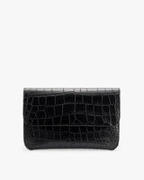 Rectangular clutch with croc-embossed leather design.