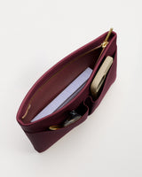 Open handbag with notebook and phone inside