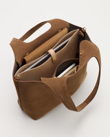 Open tote bag with multiple compartments and a laptop inside.