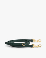 Long adjustable strap with gold-toned clasps and buckle.