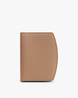 Textured leather passport holder with a curved edge