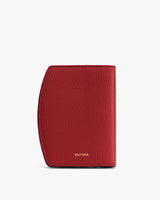 Textured leather passport holder standing upright