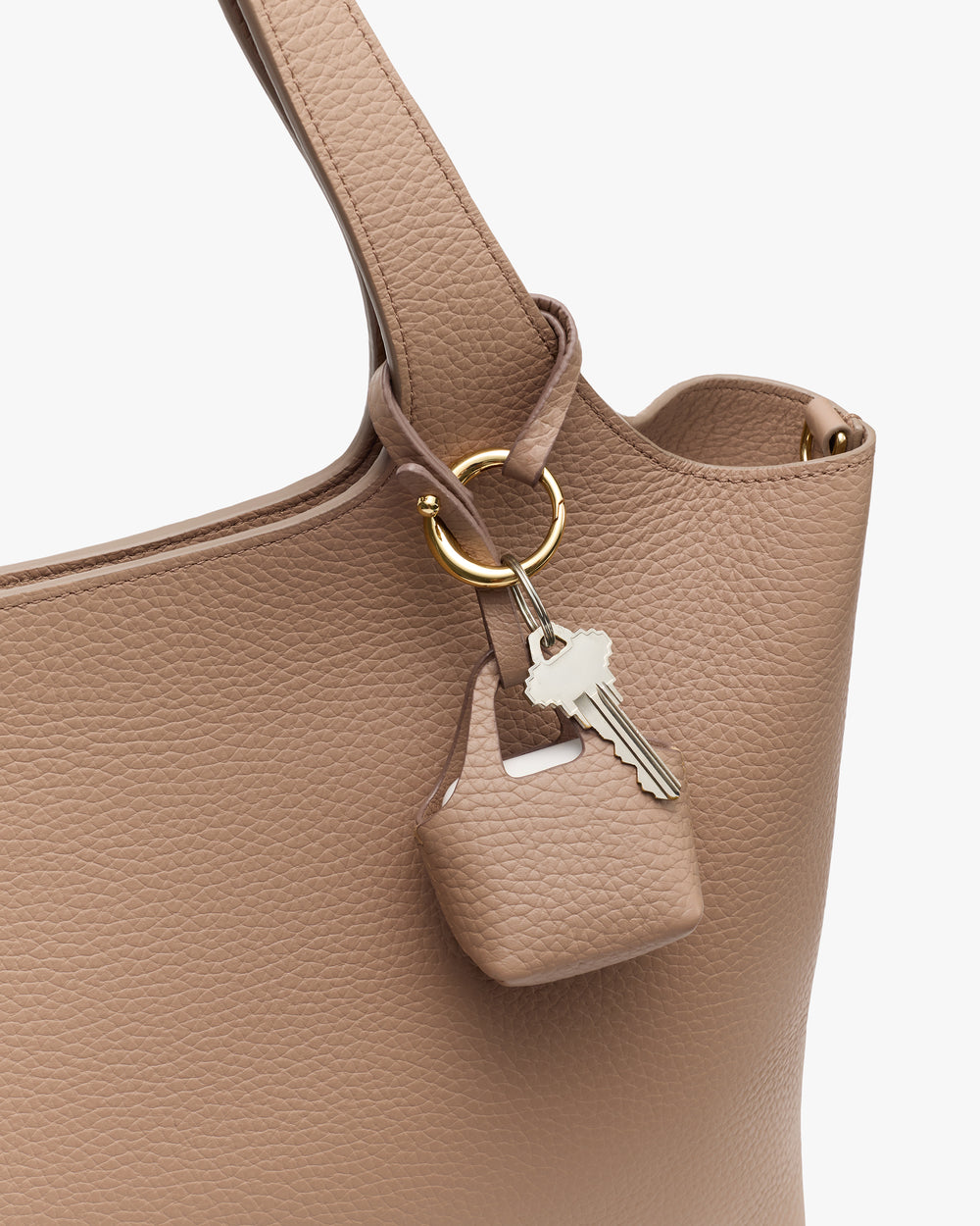 System Tote Charm Bag handle with a small pouch and key attached by a ring.