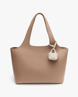 Handbag with dual handles and small attached pouch.