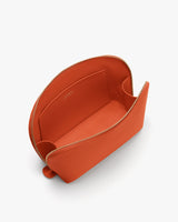 Open zippered handbag with interior pocket.