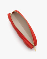 Top view of an open zippered clutch bag.