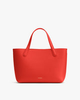 Simple tote bag with two handles on a plain background