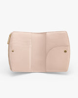 Open wallet with multiple pockets and a zipper closure.