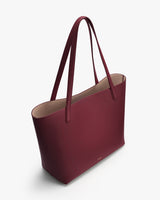 Tote bag with two long handles and an open top.