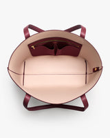 Open tote handbag with interior zip and slip pockets