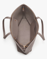 Open tote bag showing interior with zipper pocket and two handles.