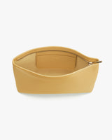 Open clutch bag with zippered compartment and pocket inside.