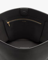 Open bag displaying a zippered pocket inside.