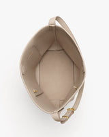 Open handbag with shoulder strap and small interior pocket.
