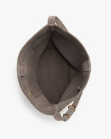 Open tote bag with interior view showing lining and a small pocket.