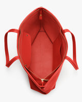 Open tote bag with a zippered pocket inside and two handles.