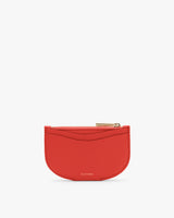 Small pouch with a zipper on top against a plain background.