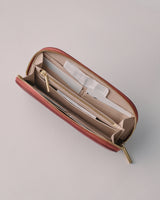 Open wallet with multiple compartments and a zipper.