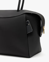 Large travel bag with phone in side pocket and two handles.