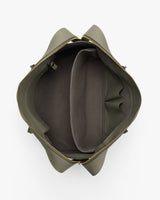 Open travel bag with interior compartments and zipper.
