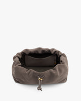 Open drawstring pouch with a pocket inside.