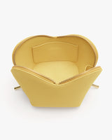 Open handbag with interior pocket and zipper closure.