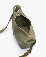 Open handbag with visible interior and zipper closure.