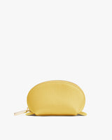 Small half-circle pouch with a zipper on a plain background.
