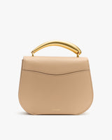 Handbag with rounded flap and curved metal handle