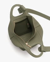 Open handbag with zipper and inner pocket visible.