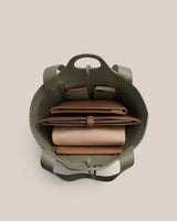 Open bag with organized compartments holding items inside.