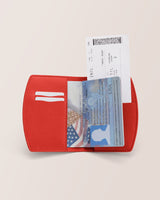 Passport and boarding pass in a wallet.
