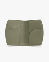 Open wallet with textured surface and card slots displayed.