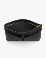 Open black bag with a gold zipper, viewed from the top.
