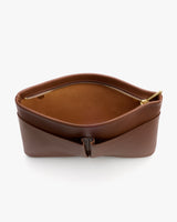 Open leather pouch with zipper and front pocket.