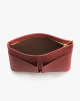 Open zipper pouch with compartments visible inside.