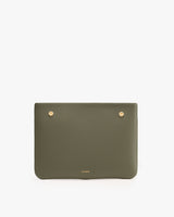Rectangular leather clutch with two gold studs on top.