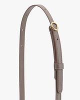 Leather belt with metal buckle and adjustable holes.