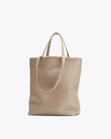 A plain tote bag with short handles displayed upright.