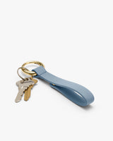 Keychain with a loop and two keys attached.