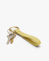 Keychain with two keys and a leather loop.