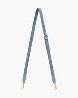 Adjustable strap with clasps on both ends against plain background.