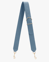 Wide adjustable strap with gold clips and buckle adjustments on white background.
