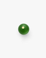 Round button with small central dot on white background
