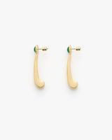 Two gold-tone earrings with a curved design and green accents at the top.