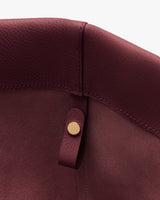 Close-up of a bag's interior with a button detail.