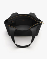 Open tote bag with interior pocket and zipper seen from above.