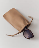 Sunglasses in soft pouch with drawstring closure