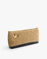 Woven clutch purse with black base and decorative accents on the front.